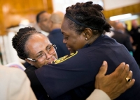 Dallas County Sheriff Deputy Sgt S. Wesley is comforted by fellow deputy C. Coleman during a prayer vigil community meeting hosted by Dallas Area Interfaith at Southern Hills Church of Christ on July 10, 2016 in Dallas. 